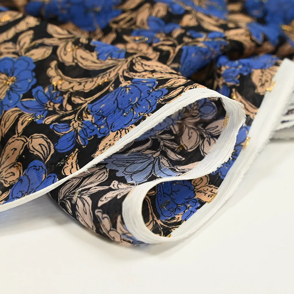 Mousseline imprimée plumetis lurex fleurs bleues et beige fond noir