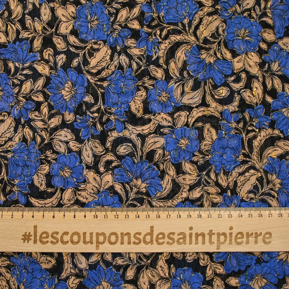 Mousseline imprimée plumetis lurex fleurs bleues et beige fond noir